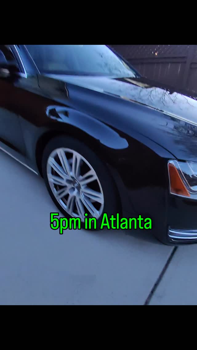 Black Audi A8 outside a home, pictured on the original cover of New Image’s step-by-step repair reel