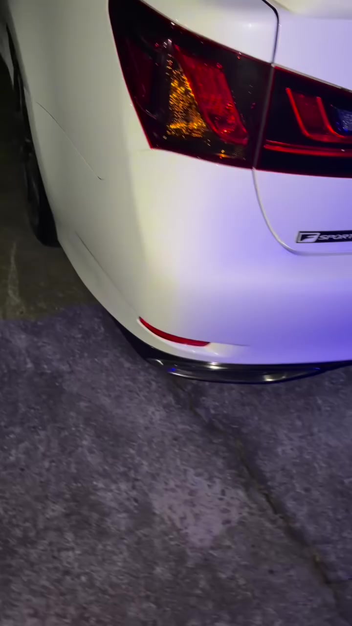 Pearl-white Lexus F Sport rear bumper in the finished-repair sequence of New Image’s original video