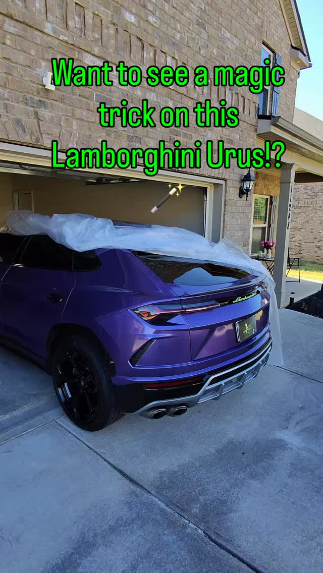 Purple Lamborghini Urus masked at a residential garage before its rear diffuser is refinished from silver to black