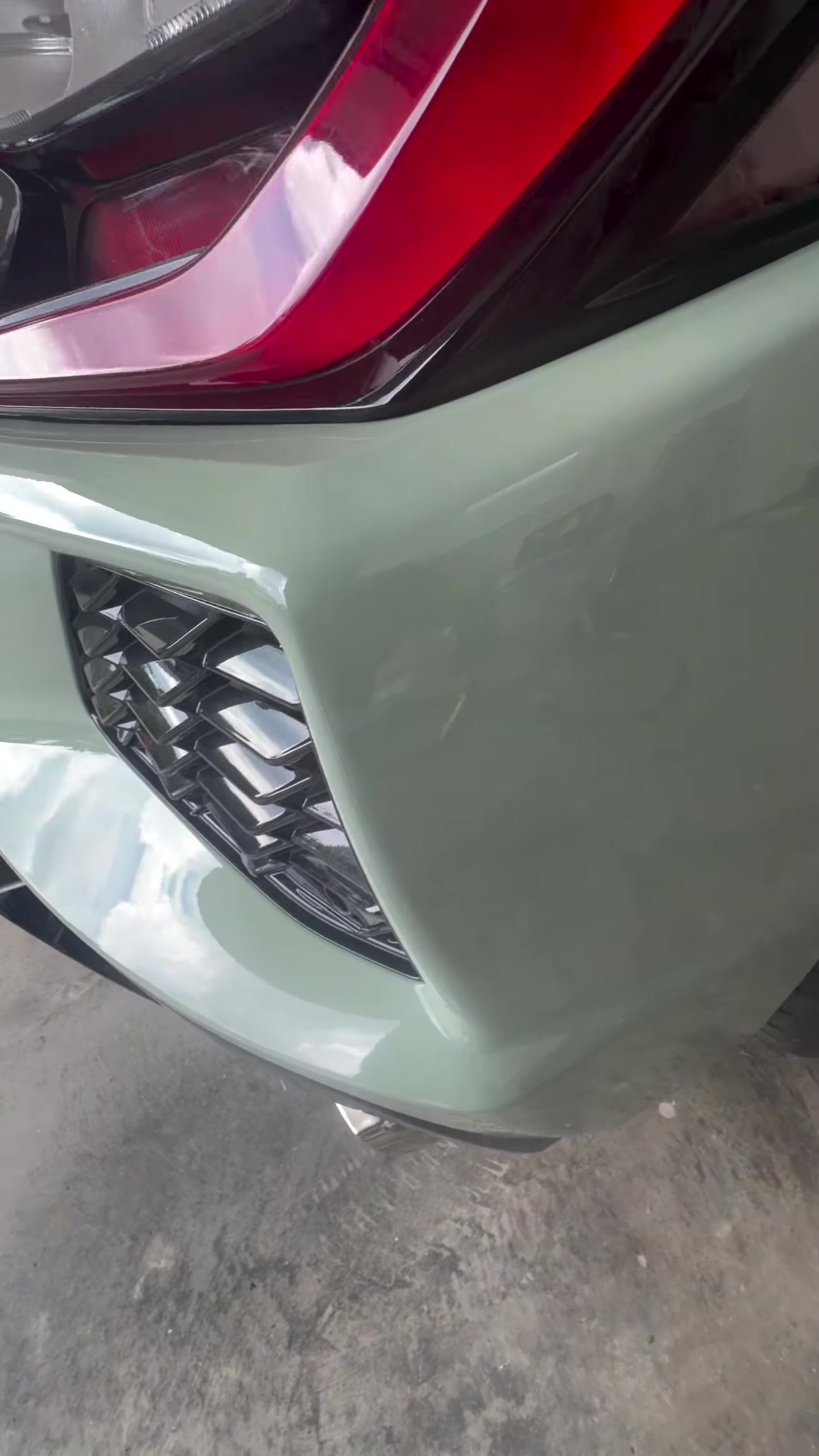 Close-up of the Corvette Stingray rear bumper from New Image’s repair video at a customer’s residential garage